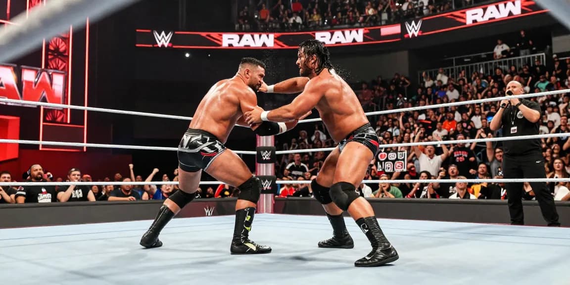 Electric atmosphere at WWE Raw event with fierce wrestlers in action.